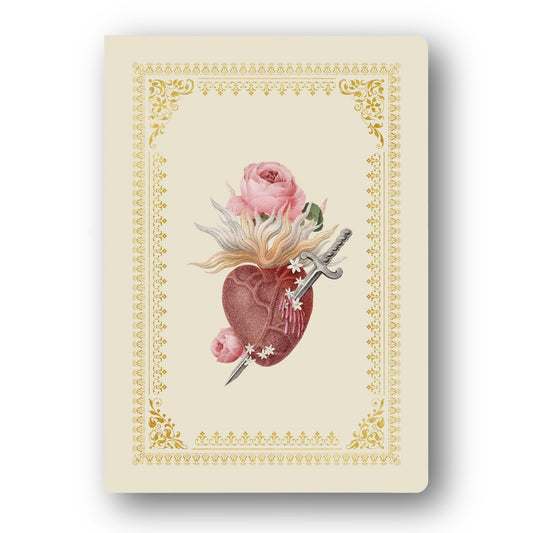 A cream-colored notebook or card featuring a vintage-style illustration of a pierced anatomical heart with pink roses and a dagger, framed by an ornate gold border.